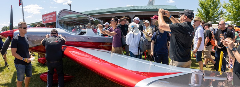 The new all-composite $450,000 Extra Aircraft NG, a departure from Walter Extra's steel frame design familiar to many aerobatic pilots, is unveiled at EAA AirVenture July 22. Photo by Evan Peers, Airspace Media.