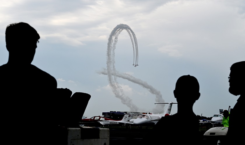 Airshow support personnel watch the afternoon show from their hangar during EAA AirVenture 2019. The 2020 event has been canceled because of the coronavirus pandemic, but EAA is launching a virtual AirVenture to bring the community together. Photo by David Tulis.