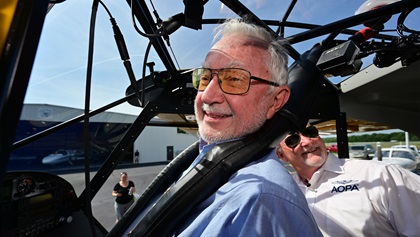 Eighty-year-old student pilot and AOPA Sweepstakes Super Cub winner Wade Shealy smiles as he straps in with AOPA President Mark Baker for a familiarization flight to Lake Keowee, South Carolina, July 15. Photo by David Tulis.