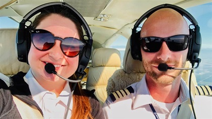 California Aeronautical University officials complimented pilots and inaugural graduating class members Elza Nikita and Aaron Hepps as role models for other students. Photo courtesy of California Aeronautical University.
