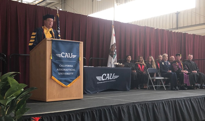 California Aeronautical University President Matthew Johnston addresses the inaugural class of graduates during a ceremony in Bakersfield, California. Photo by Tom Linton.