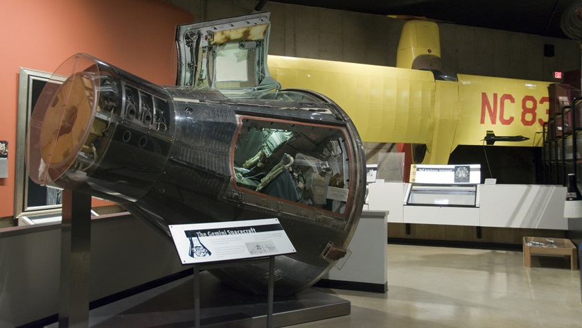 The Gemini 8 spacecraft flown by Apollo astronaut Neil Armstrong, and the Aeronca Champion airplane in which he learned to fly, in the Armstrong Air and Space Museum, Wapakoneta, Ohio. Photo by Dennis K. Johnson.