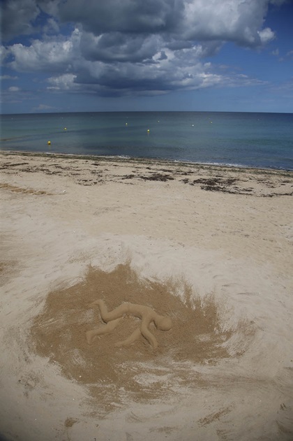 Sand art on Sword Beach is a shocking remembrance of the lives lost here. Photo by Chris Rose.