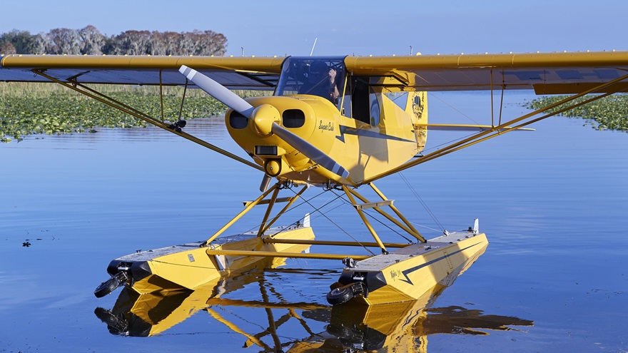 AOPA's Sweepstakes Super Cub motors along on Lake Pierce in Florida. Photo by Mike Fizer.