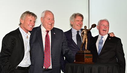 Hoover Trophy award winners Sean D. Tucker (2017), Clay Lacy (2019), and Harrison Ford (2018) share a smile with AOPA President Mark Baker during the fourth annual Bob Hoover Trophy reception presented by AOPA in the Terminal A lobby of Ronald Reagan Washington National Airport in Washington, D.C., March 20. Photo by David Tulis.