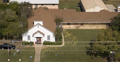 Flags mark evidence on the lawn of First Baptist Church in Sutherland Springs on Monday November 6, 2017, a day after 26 people died in a mass shooting. Photo by Jay Janner/Austin American-Statesman used with permission.