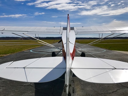 A Super Cub is parked on the ramp in the morning light. The aircraft has simple systems, but it demands finesse and attention all the way to the hangar. Photo by David Tulis.