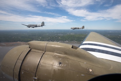 <em>Betsy’s Biscuit Bomber</em> maintains position on the left side of the lead vic as 15 warbirds fly in formation down the Hudson River to New York on May 18. All three of these aircraft pictured took part in the D-Day invasion 75 years ago. Photo by Jim Moore.