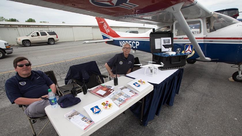 Civil Air Patrol officers Craig Kuhn, left, and Howard Hampson included one of the Maryland Wing’s new DJI Phantom 4 quadcopters at the AOPA Fly-In. CAP pilots nationwide are training to integrate unmanned aircraft in various operations. Photo by Jim Moore.