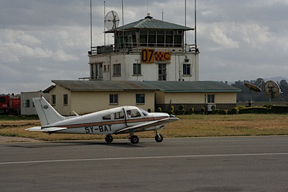 A Piper Cherokee Warrior taxis past the control tower at Wilson Airport in Nairobi, Kenya. Photo courtesy of Amy Laboda.
