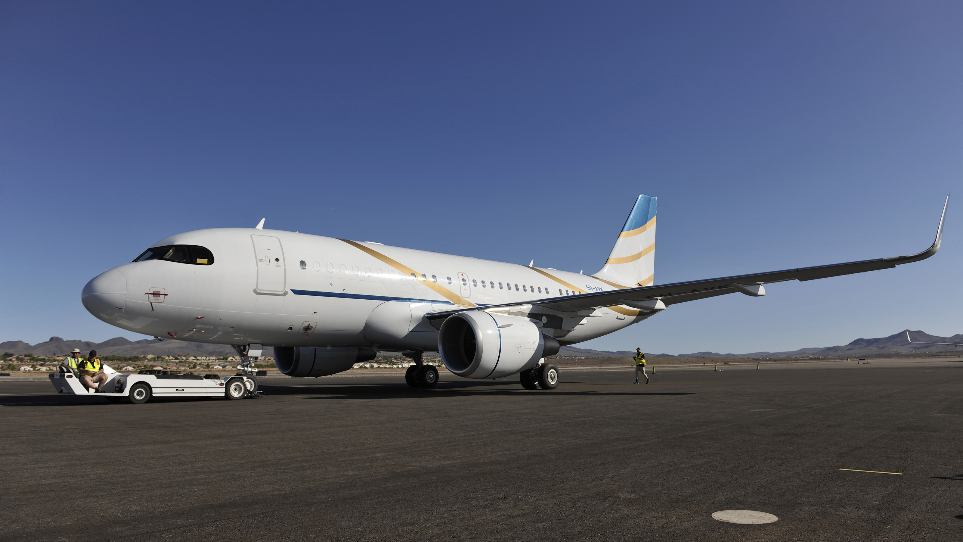 A Comlux Airbus AJC319neo gets tugged at the National Business Aviation Association annual convention in Las Vegas. Photo by Mark Wagner.