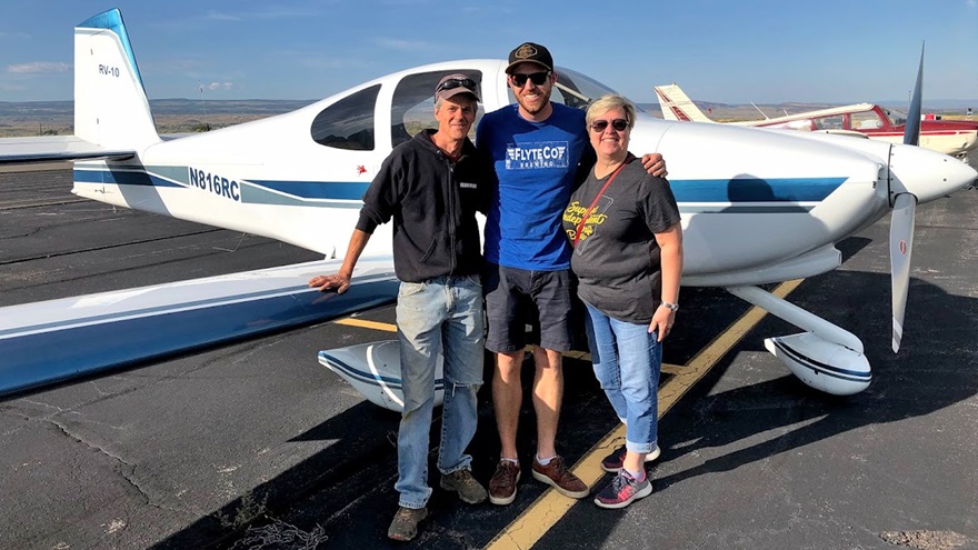 David Warren, left, owner of High Wire Hops, and Eric Serani and Lee Ann Hahne of FlyteCo Brewing stand by Serani's Van's RV-10 before loading its cargo of fresh hops. Photo courtesy of FlyteCo Brewing and Bruz Beers.

