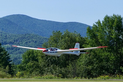 Sixteen-year-old Lauren Tulis is at the controls for a landing during a youth sailplane camp Vermont. She said glider flying required a sensitive touch and constant awareness of your surroundings. Photo courtesy of Tom Anderson.