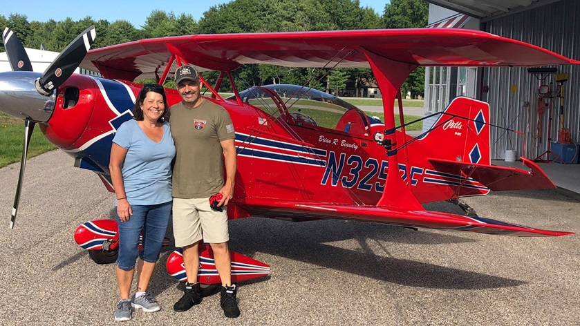 Rockingham County bailiff Julie Cashman recently joined New Hampshire pilot Brian Beaudry during a Props for Cops outreach flight in a Pitts S–2C aerobatic biplane. Photo courtesy of Brian Beaudry, Props for Cops.