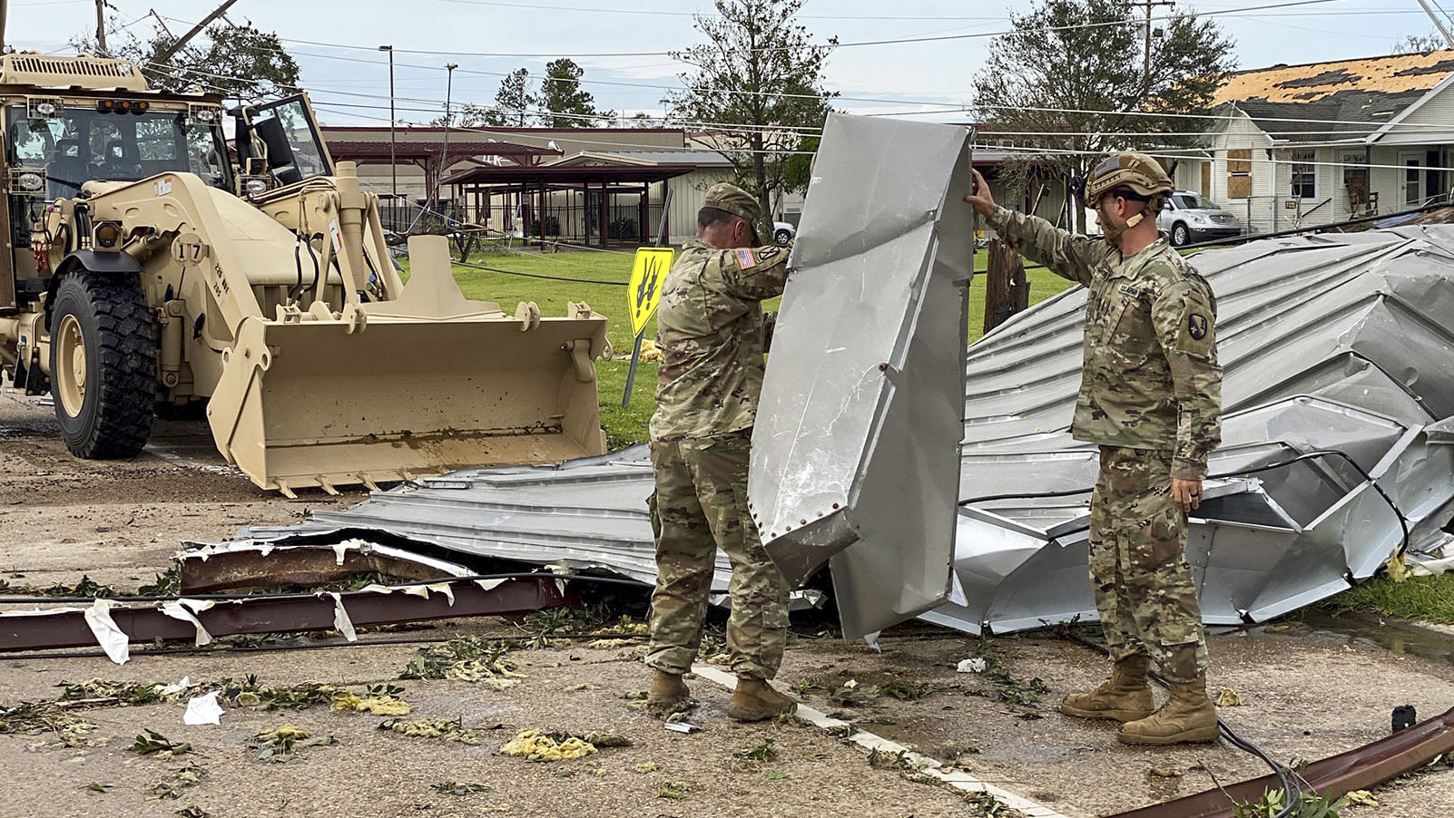 Louisiana National Guardsmen clear roadways in Lake Charles, Louisiana, and begin to assess the damage from Hurricane Laura. Photo  by Army Staff Sgt. Josiah Pugh, U.S. Department of Defense.