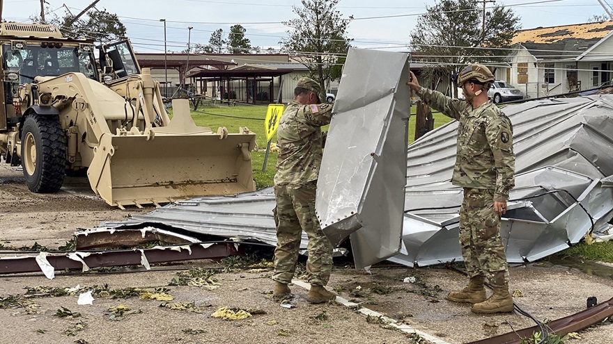 Louisiana National Guardsmen clear roadways in Lake Charles, Louisiana, and begin to assess the damage from Hurricane Laura. Photo  by Army Staff Sgt. Josiah Pugh, U.S. Department of Defense.