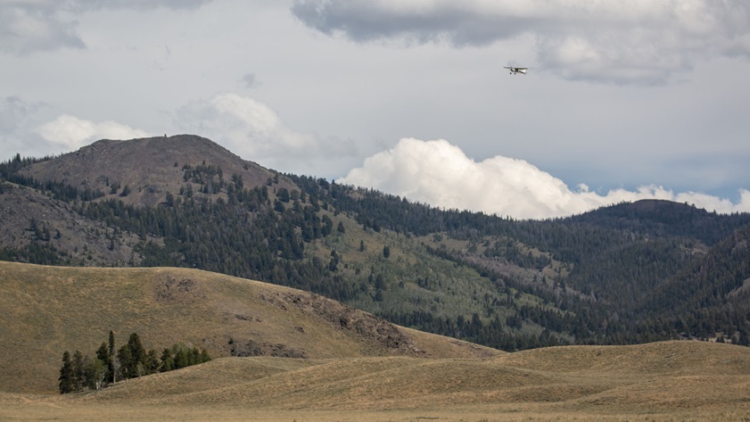 Idaho Aviation Association President Andrew George departs Smiley Creek Airport in his Cessna 180 Skywagon after a productive day of discussion at the August 12 Backcountry Safety Summit, hosted by the AOPA Air Safety Institute. Photo by Tyler Pangborn.