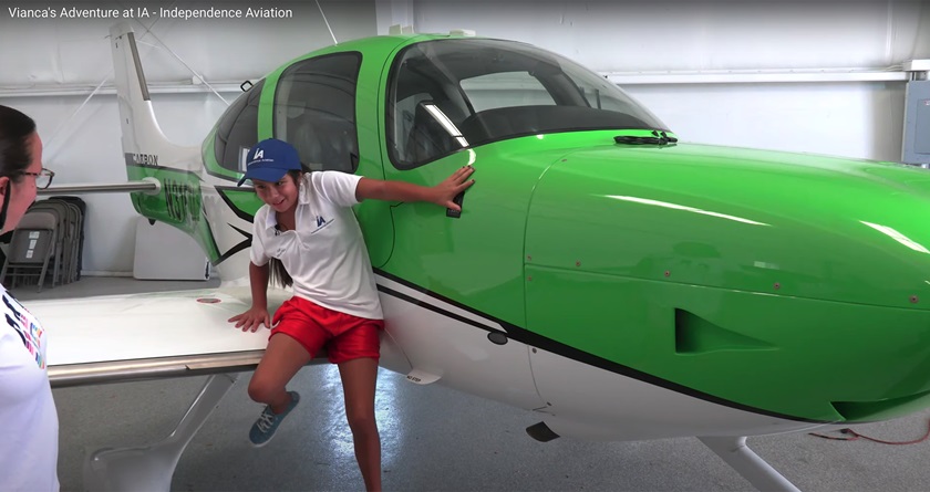 Bernice Geels looks on as granddaughter Vianca Marez, 12, who was born blind, jumps from the wing of a Cirrus single-engine aircraft after handling the flight controls of a Cirrus SR20 with backup from Independence Aviation LLC owner and CFI Bob Stedman in Denver. Image courtesy of Angel Andres Rosado, Independence Aviation LLC.