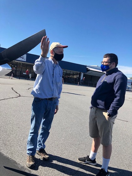 STEM Flights Pilot Mentor Bill Kahn demonstrates how to check the prop during preflight inspection. His passenger, Gabe Turner, is currently taking the AOPA High School STEM Curriculum at Greenville Technical Charter High School in Greenville, South Carolina. Photo courtesy of STEM Flights.