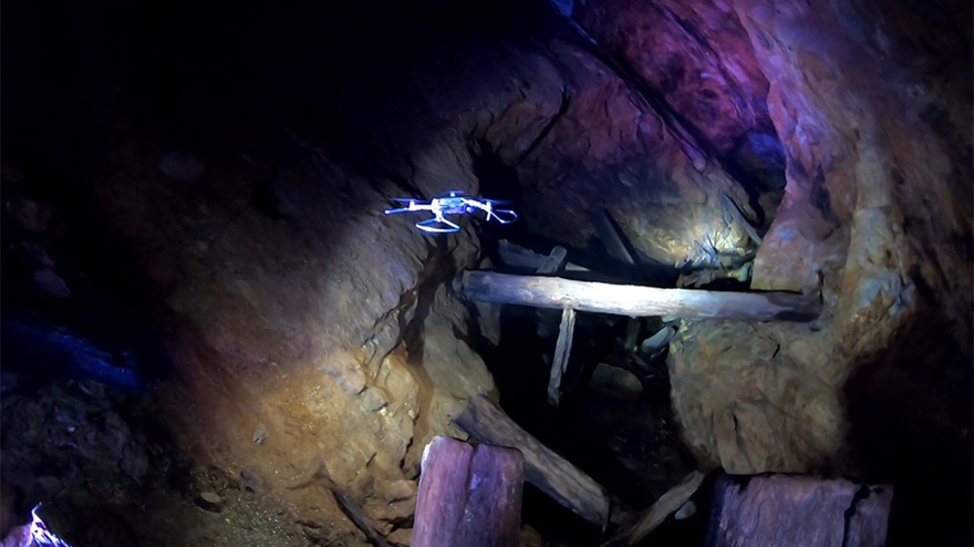 A DJI Mavic 2 Pro equipped with prop guards makes its way slowly through an area known as a stope (an opening left behind after extracting ore) 200 feet below ground as it retraces the steps of miners over a century ago. Photo courtesy of Inspired Intelligence. 