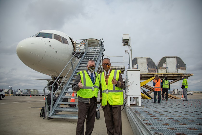 UPS pilots Neal Newell (left) and Houston Mills pause for a photo as the vaccine is unloaded in Louisville, Kentucky, on December 13. Photo courtesy of UPS Inc.