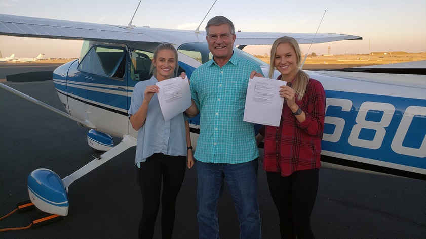 Twin sisters Lexie Wilson (left) and Emily Wilson (right), pictured with Designated Pilot Examiner Tom Gregory, took their private pilot checkrides on the same day. Photo courtesy of Curtis Wilson.