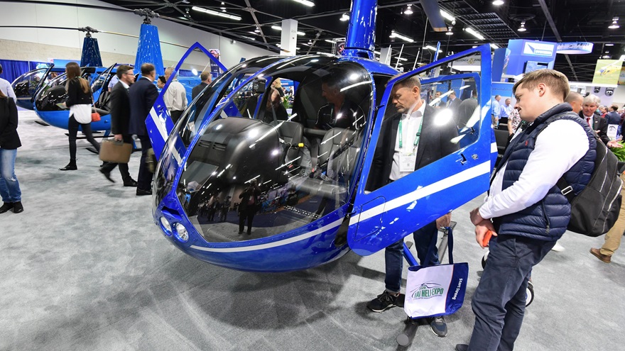 Robinson's popular R44 and R66 helicopters are examined by visitors to HAI Heli-Expo 2020 in Anaheim, California. Photo by Mike Collins.