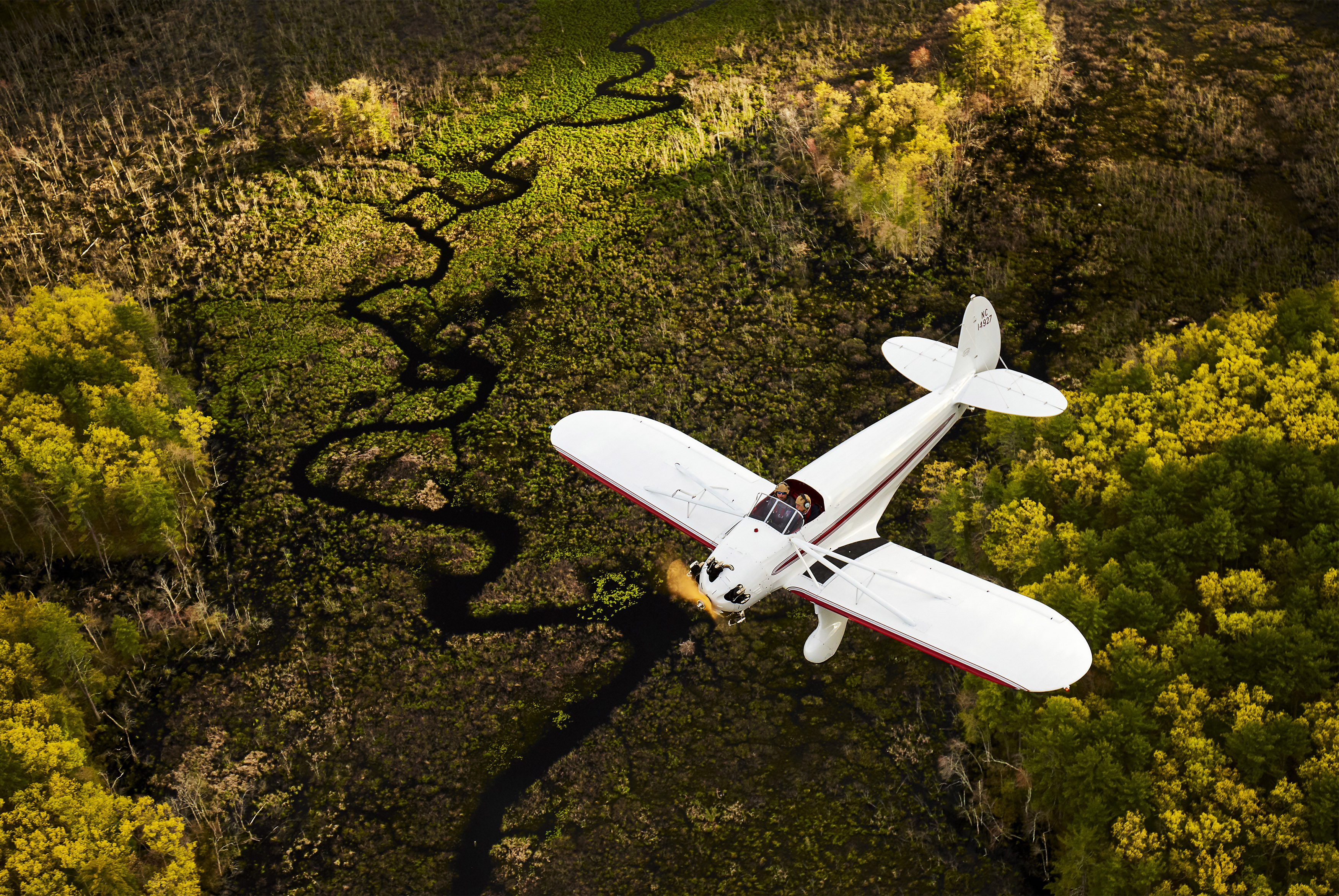 A 1935 Kinner Sportwing, restored by David DeVries of Windham, New Hampshire, is framed by the Atlantic coast near Boston. Photo by Mike Fizer.