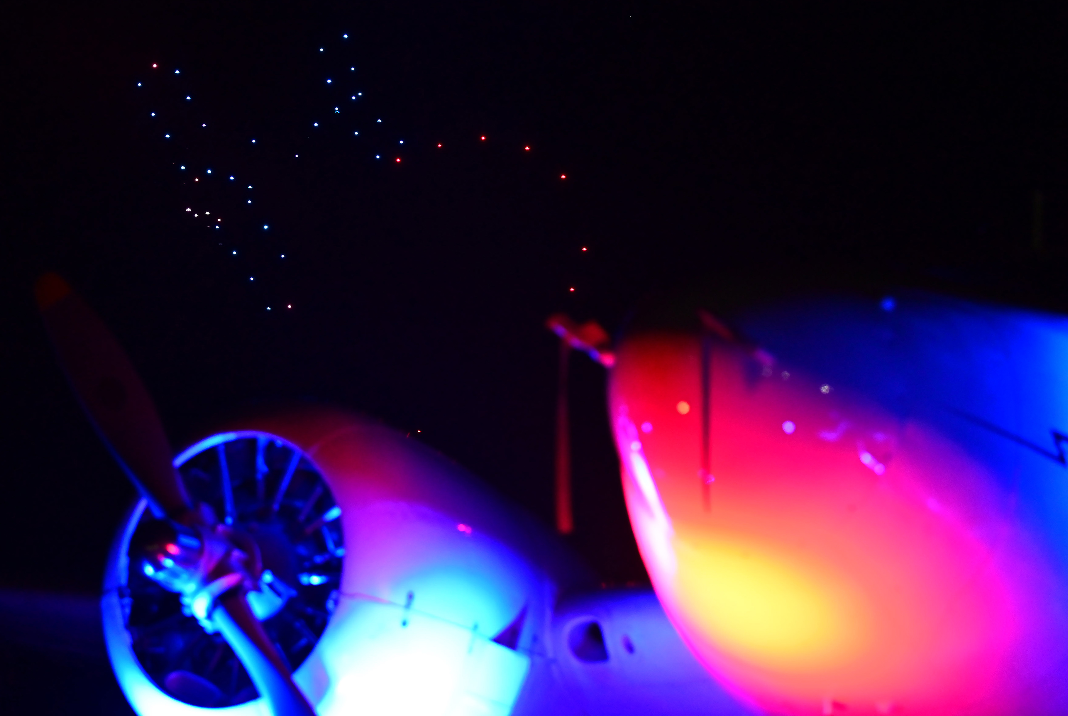 A Beechcraft Model 18 frames a drone performance during the AOPA Tullahoma, Tennessee, Fly-In. Photo by David Tulis.