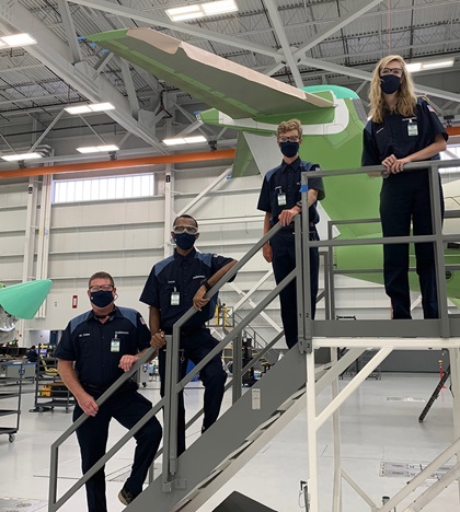 Riverwood International Charter School students from the Atlanta area won the GAMA 2020 Aviation Design Challenge. Instructor John Friske, left, joins students Lucas Daniels, Coleman Alvarez and Jessica Keen, right, during a tour of Gulfstream Aerospace in Savannah, Georgia. Photo courtesy of Gulfstream Aerospace and GAMA.