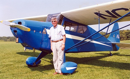 Antique Airplane Association founder Robert L. "Bob" Taylor poses for a photo beside the 1941 Interstate Cadet S-1A that he soloed in shortly after World War II and decades later tacked down and restored. Photo courtesy of the Antique Airplane Association.