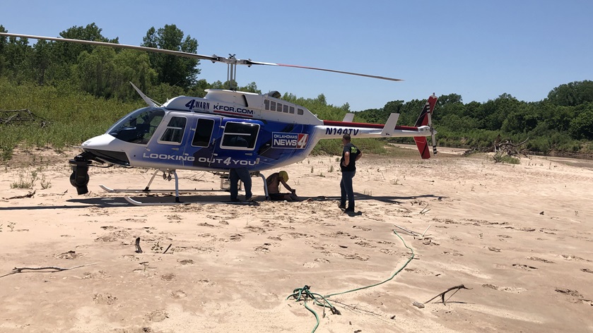 KFOR-TV Managing Editor Steve Johnson and Oklahoma television station helicopter pilot Mason Dunn spotted a lost rafter in the North Canadian River from the Bell 206L LongRanger news gathering platform. Photo courtesy of KFOR-TV.