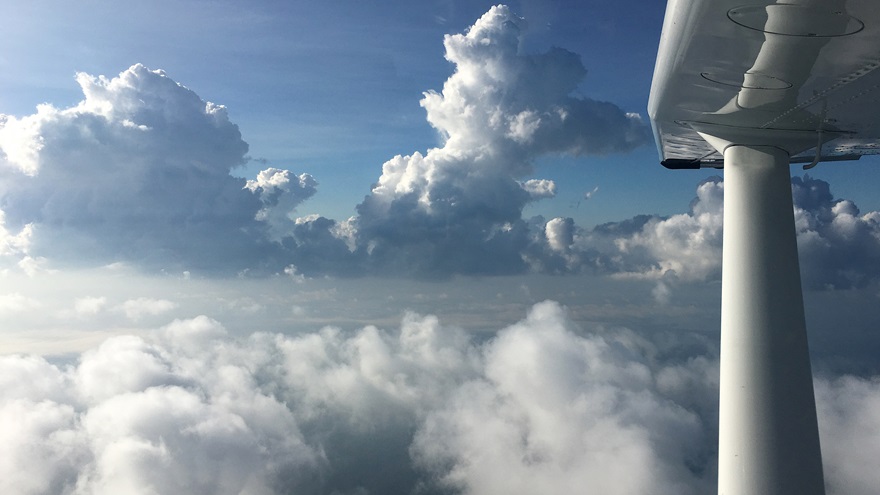 The Cessna 182's excellent performance capabilities provide a wide range of altitudes to choose from. But beware: VFR flight above scattered clouds in the summertime can become an issue when those cumulus clouds begin to build with convective activity. During a trip from Tennessee to Maryland, buildup that began to exceed 11,500 feet demonstrated that it was possible to get trapped above rising clouds. Photo by Chris Eads. 