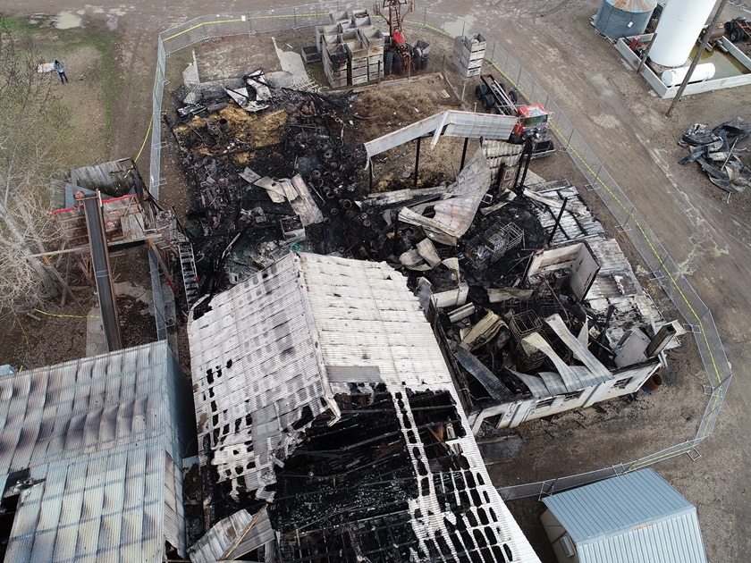 Tom Powers has a variety of drones available with which to shoot inspections. In this photo he is using a Phantom 4 Pro V2 and a CrystalSky monitor while documenting a hops processing plant that burned. Powers is in the upper left corner of the frame.  Photo courtesy of Tom Powers.