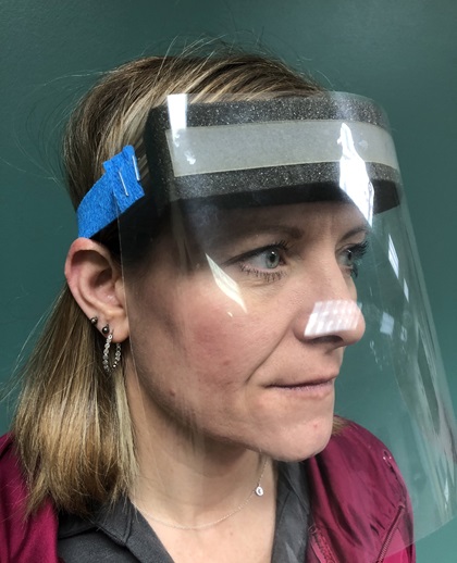 A face shield prototype is demonstrated after Michigan Seaplane owner Cran Jones formed a plan to manufacture and deliver much-needed clear face shields to front-line medical professionals. Photo courtesy of Cran Jones.