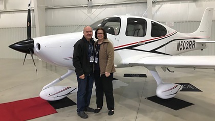 Harmony Air owner Randy Harmon and his wife Ruthanne with their Cirrus SR20 airplane. The parked aircraft was destroyed in the March 3 storm that wreaked havoc on John C. Tune Airport in Nashville. Photo courtesy of Randy Harmon.