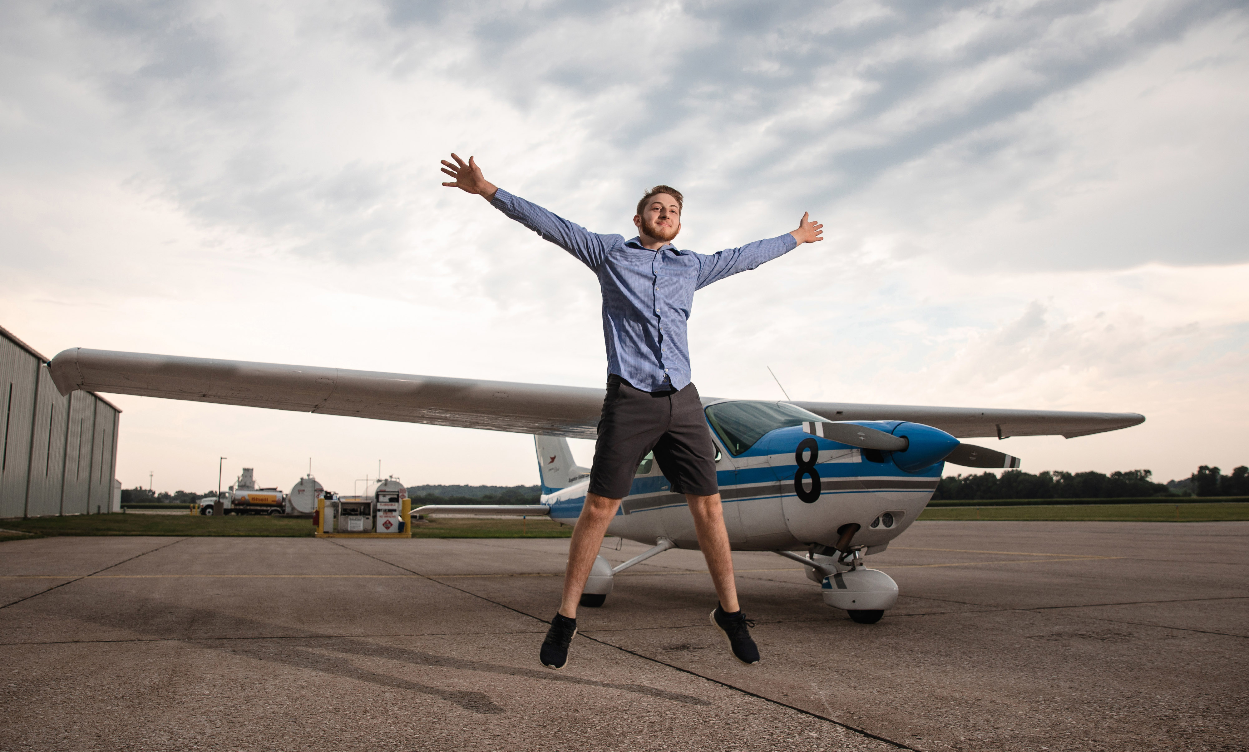 Colin Eberl, 18, is a soloed student pilot who is graduating from Iowa City West High School in Iowa City, Iowa. He plans to pursue a bachelor of science degree in nutrition and exercise science at the University of Iowa and plans to continue pursuing aviation as a hobby. His dad, Daniel Eberl, said the photo was taken in front of the family airplane, a 1978 Cessna Cardinal co-owned by Minnetta Gardinier, a frequent participant in the all-female Air Race Classic (hence the race number). Photo by Emily Jia Photography.            