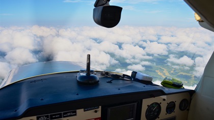 VFR over the top can be tricky. How far the cloud layer extends; whether it is scattered, broken, or overcast; how to get back down; and the possibility of an emergency are all critical factors to consider. Photo by Chris Eads.