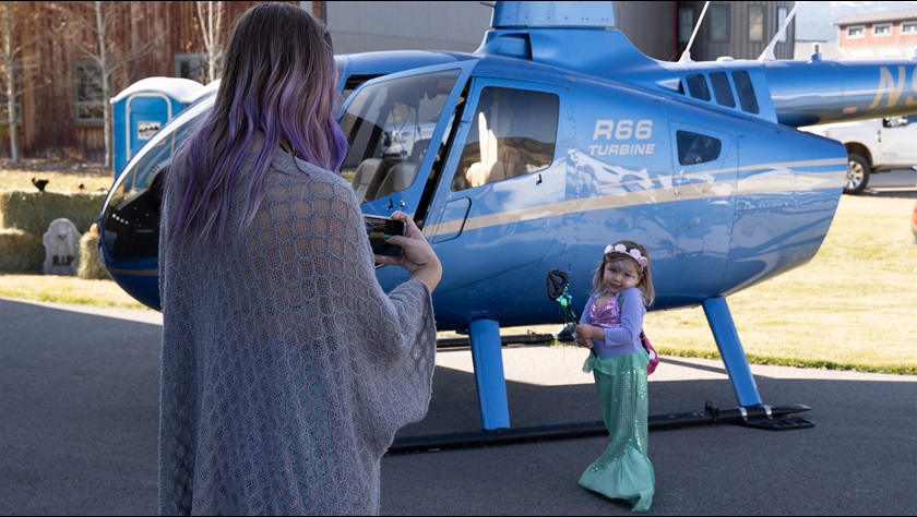 Airpark and community residents attended a Halloween-themed event and ceremony for the airport to present the donation check. This little mermaid might just trade her tail for some helicopter lessons. Photo by Jenna Bradford.