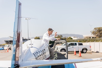 Harry Moyer waves to the dozens of people who came to San Luis County Regional Airport in California to watch his solo flight on his 100th birthday. Photo by SLO Town Studios/Welcome Home Military Heroes.