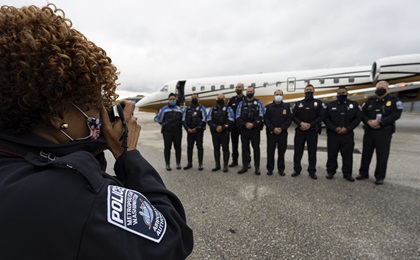 Emergency services personnel celebrate the final stop of the America’s Operation Thank You general aviation flight relay. Photo by David Tulis.
