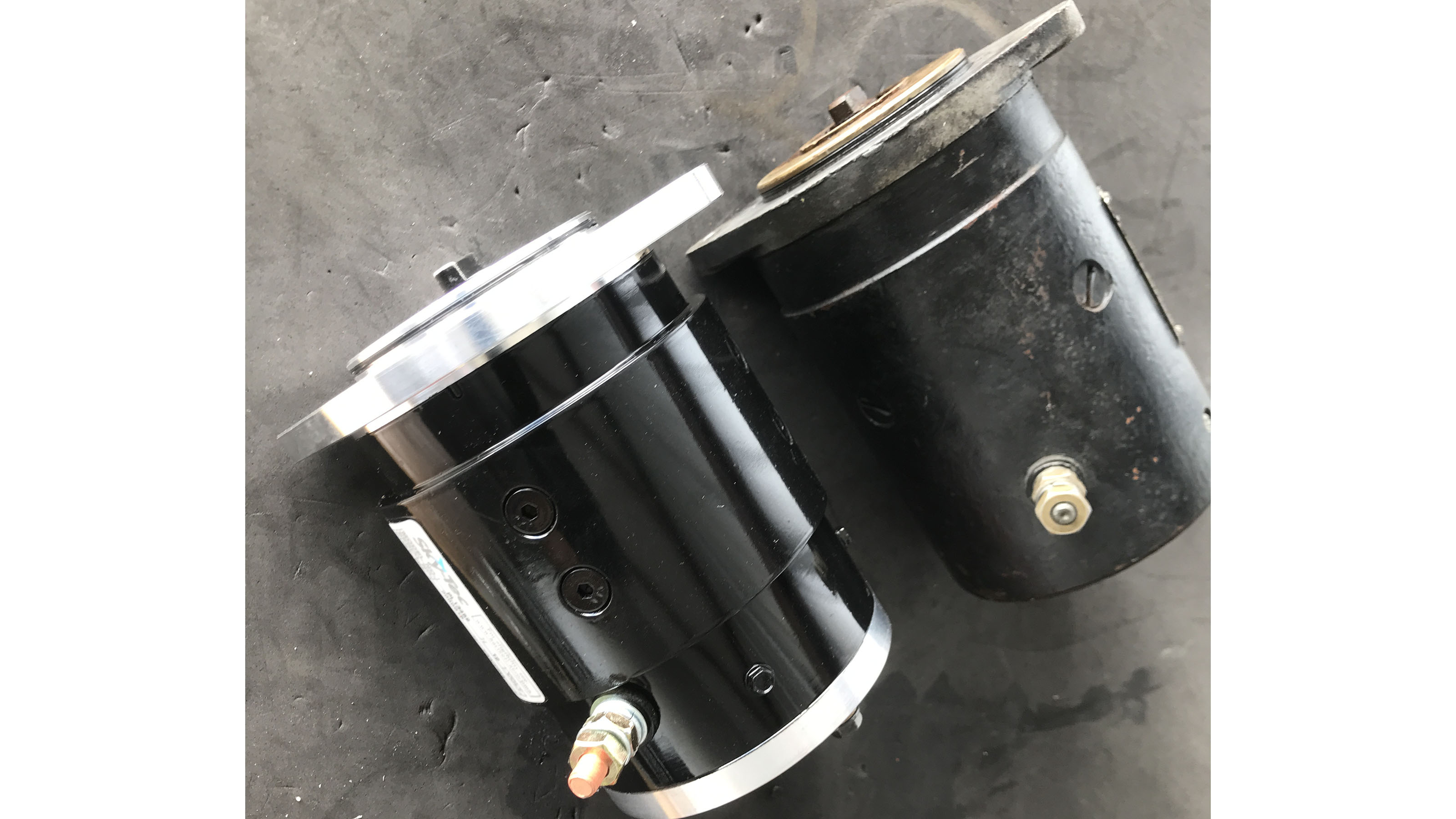 The original Prestolite starter alongside the new Sky-Tec PowerLite starter from Quality Aircraft Accessories, which saves four pounds by using a more modern, ball-bearing design. Photo courtesy of Jeff Simon.