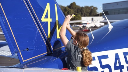 Tape is used to temporarily apply race number 41 to the Socata TB20 Trinidad flown by Michael and Elisa Coyle in the 2020 Hayward Air Rally. The first-time participants landed in eighth place. Photo by Carl La Rue.