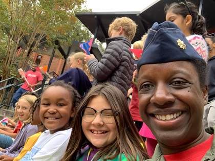 U.S. National Guard Maj. Michelle Scott shares time with young girls. Photo courtesy of OBAP.
