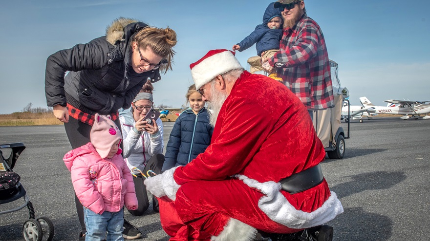 Some of Tangier's children greet Santa at the island's airport. Photo courtesy of Ed Remsberg, Remsberg.com.