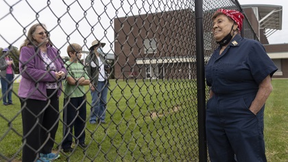 Connie Palacioz, one of the original ‘Rosie the Riveters,’ shares her story with people at a northern Virginia airport before weather postponed the September 25 2020, Arsenal of Democracy flyover of Washington, D.C., by one day. AOPA Photo by David Tulis.