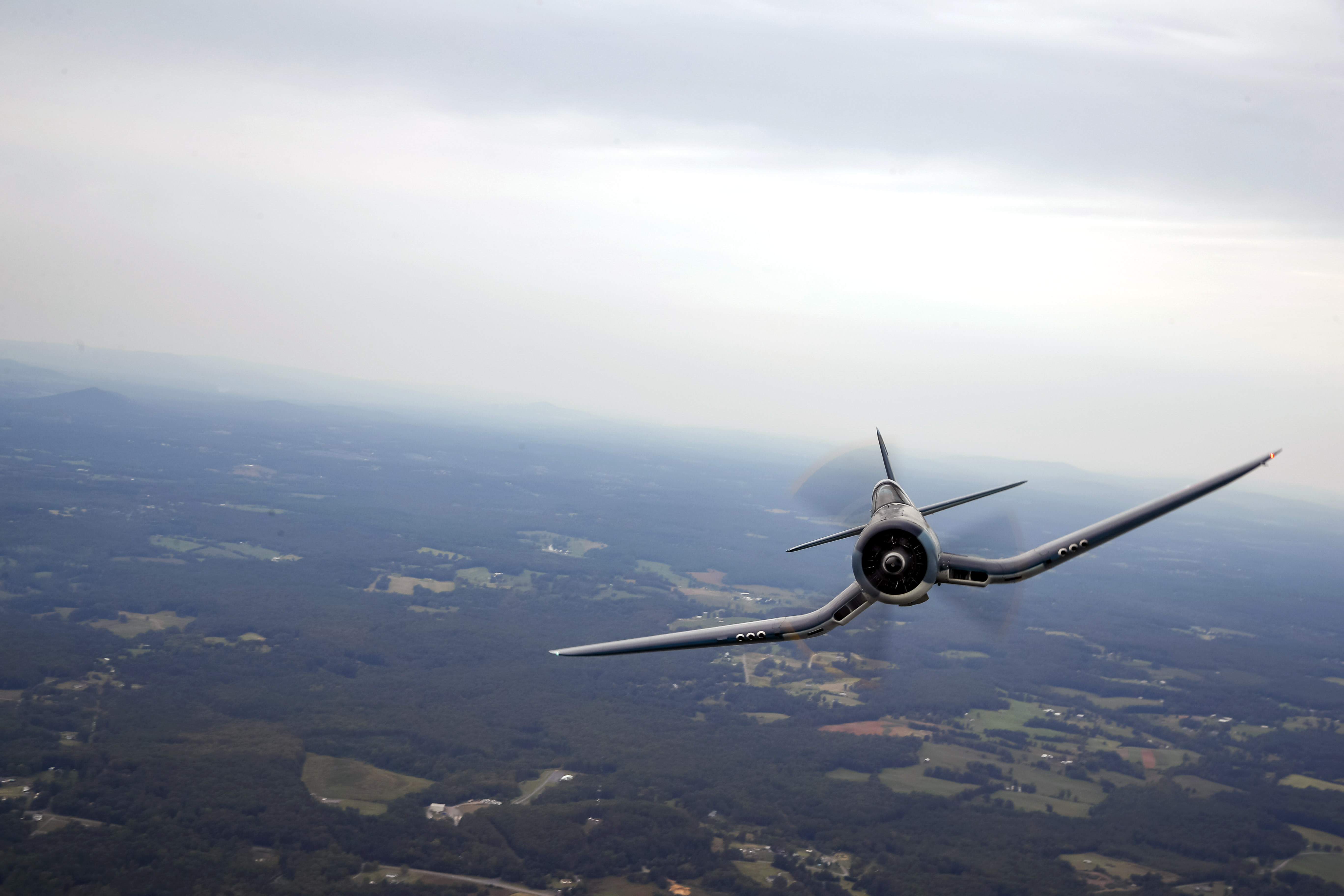 A variety of aircraft such as Vought F4U Corsair joins in on flight practice. Photo by Chris Rose.