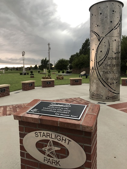 Starlight Park is on the site of Greensburg’s former city hall building that was destroyed in the 2007 EF-5 tornado. In honor of the tenth anniversary of the tornado, a public art committee developed a sculpture park, which now has three pieces including “The Beacon.” It was designed by locals and features the words: “Some of you will rebuild the deserted ruins of your cities. Then you will be known as a rebuilder of walls and restorer of homes. Isaiah 58:12.” The stars in the name of the park and the cutouts on the cylindrical sculpture refer to the state motto: “ad astra per aspera,” or “to the stars through difficulties.” Photo by MeLinda Schnyder.