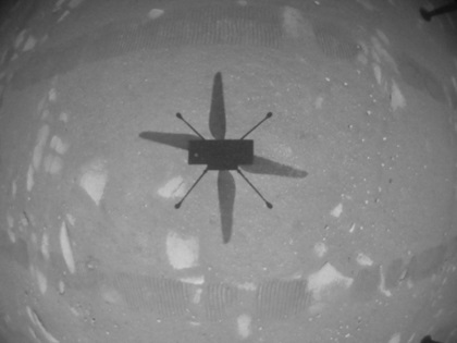 NASA's "Ingenuity" Mars Helicopter took this shot while hovering over the Martian surface on April 19, 2021, during the first instance of powered, controlled flight on another planet. It used its navigation camera, which autonomously tracks the ground during flight. Photo courtesy of NASA/JPL-Caltech.