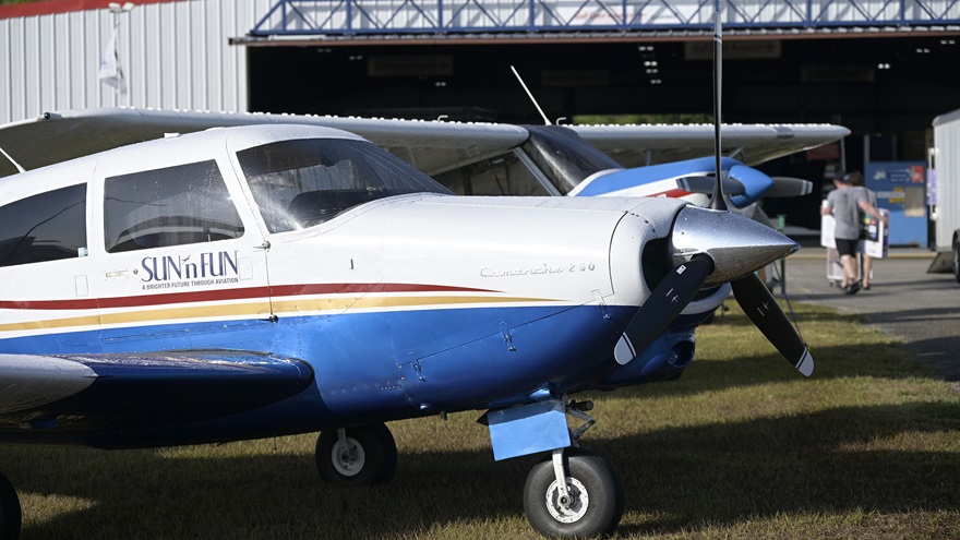 Airplanes are displayed in front of a hangar during setup for the Sun 'n Fun Aerospace Expo. Photo by Phelan M. Ebenhack.